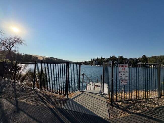 Building Photo - Home located in a gated Lakefront community with 3 swim areas & a boat dock