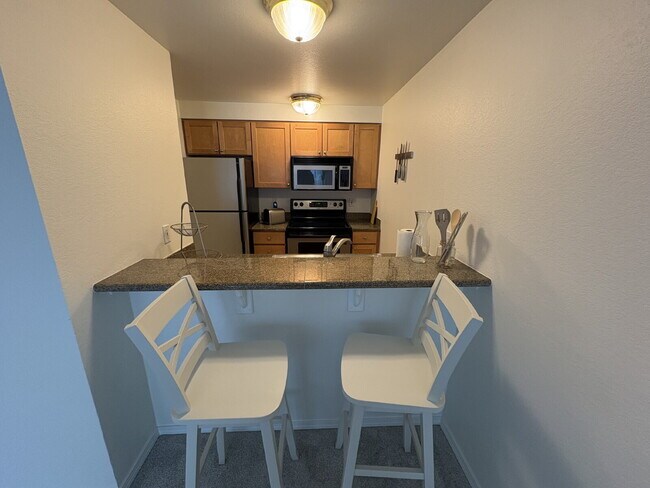 Building Photo - Bright, Modern 1BR Near Hospitals, SU & Transit in secure building with garage parking and a Walk...