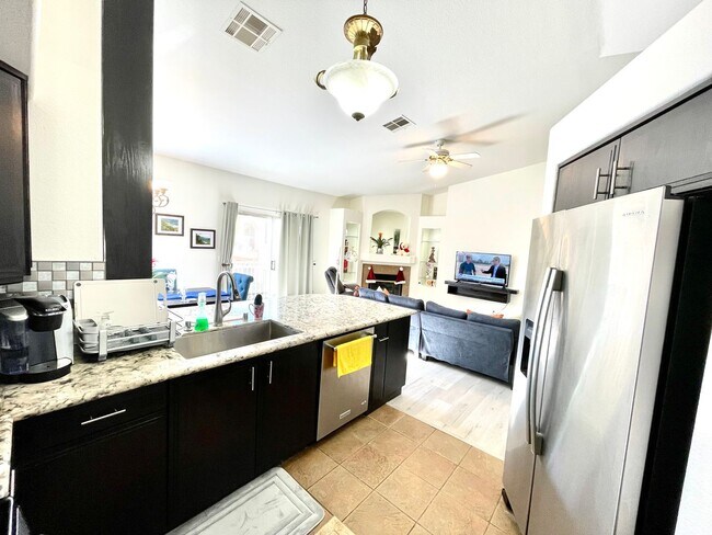 Building Photo - Partially Furnished 2/2 CONDO WITH  *BONUS DEN* & 2 CAR GARAGE!