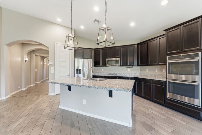 Building Photo - Stunning 4-Bed + Den Eastmark Home with Modern Upgrades Throughout