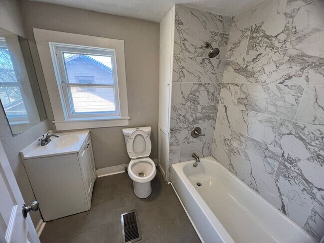 Building Photo - Updated 4-Bedroom Home with Plenty of Living and Storage Space.