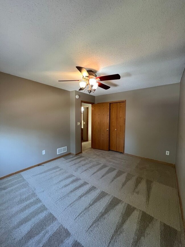 Building Photo - NE House for Rent 4 bedroom 2 full bathroom fenced in yard 2 Car attached garage.