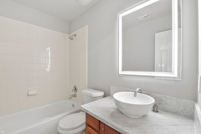 Building Photo - Stunning Corner Unit Townhome - Move-in special: Receive $100 off both your first and second mont...