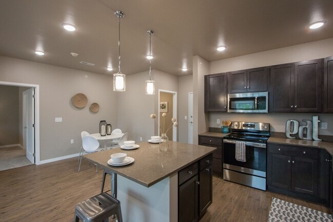 Building Photo - Spacious 1-bedroom, 1.5 bath, 1st floor, with elevated deck, available 07/01/2026