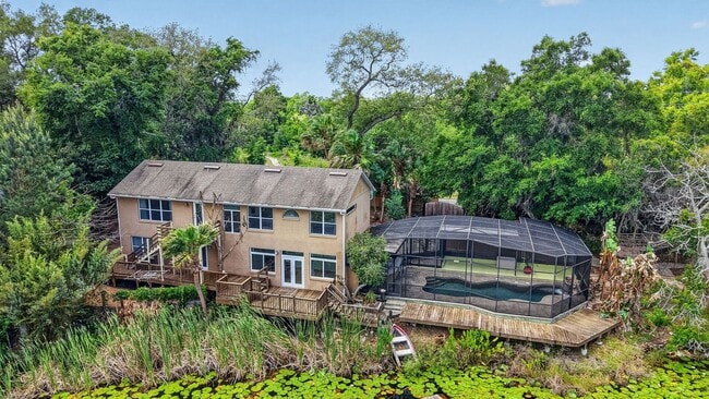 Building Photo - Available Now! Waterfront Living at Its Best – Pool, Decks & Gated Privacy