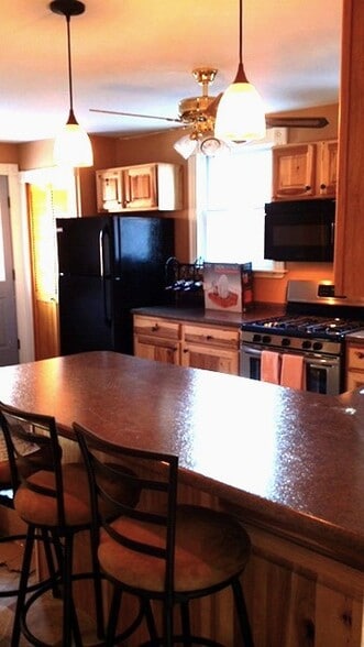Bar cozies up to the kitchen - 58 Maple St