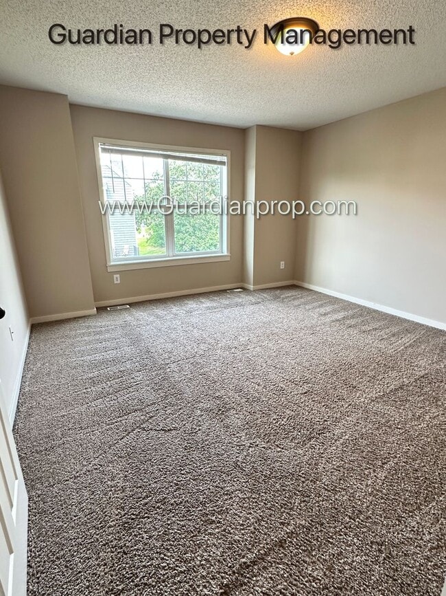 Building Photo - Champlin Town Home, 2 Car Garage, Balcony,...