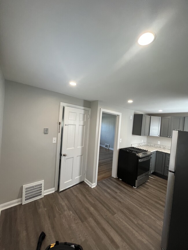 Sitting in the kitchen eating area looking into the living room. - 24730 Lake Shore Blvd