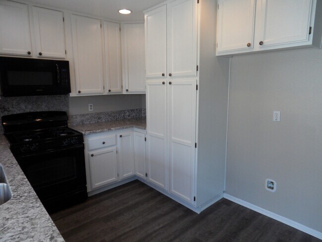 Building Photo - Two Story 4 BR 2.5 BA Condo With 2 Car Garage