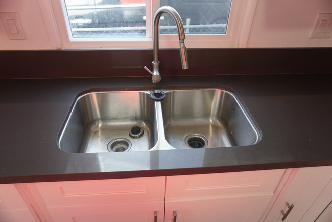 Double sink with retractable/swivel sink faucet - 224 W 84th St