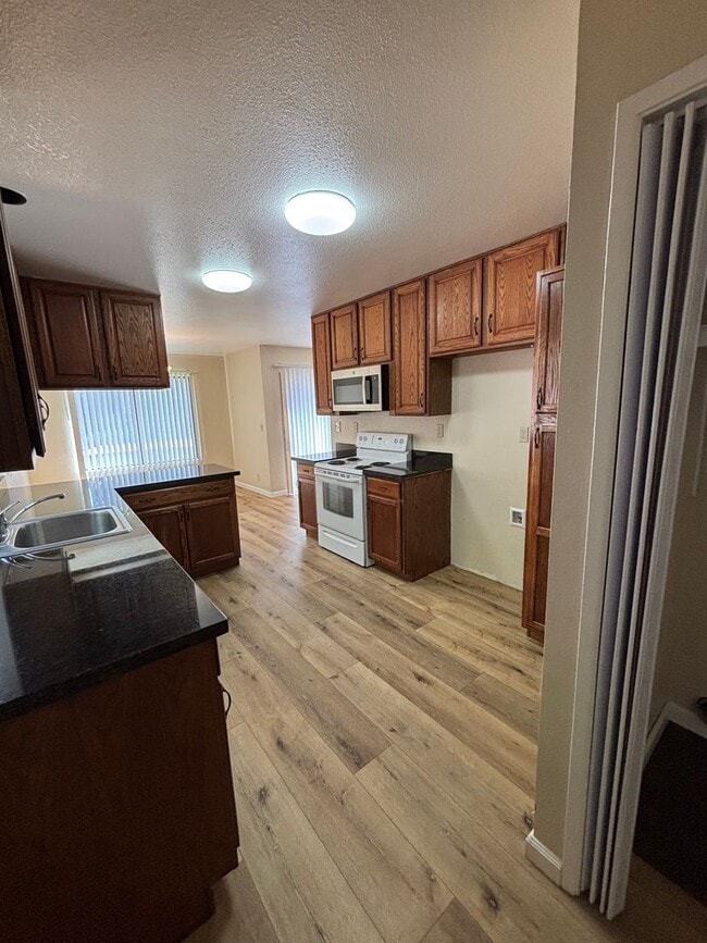 Building Photo - Spacious 4-Bedroom Home with Community Poo...