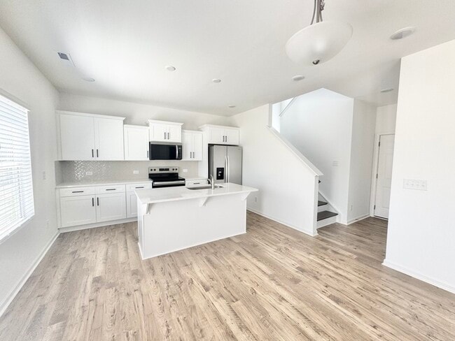 Building Photo - Four bedrooms with 2 1/2 bath with office space and loft