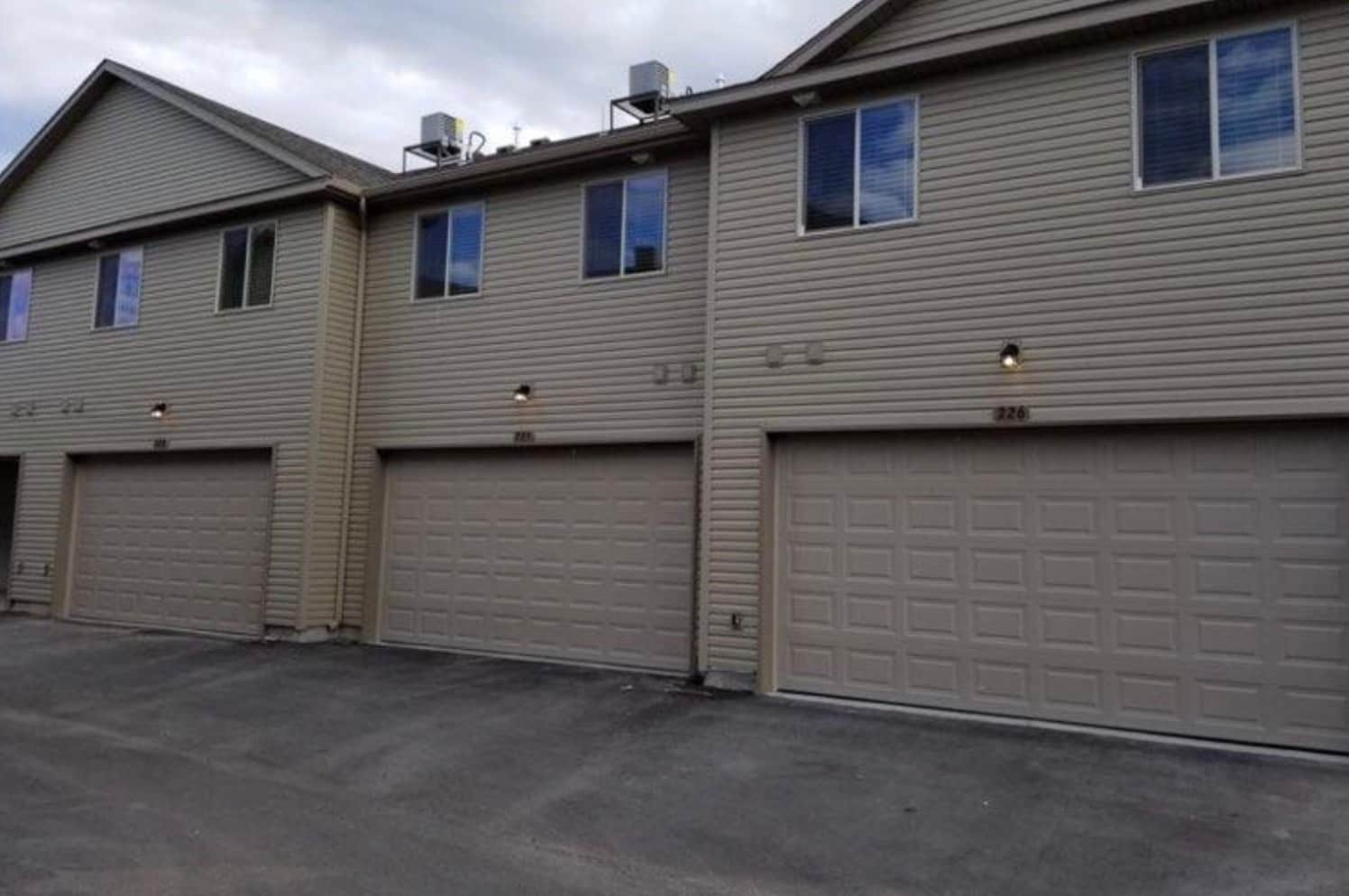 Garage door facing south (garage has an extra foot in length compared to standard). - 565 Pioneer Rd