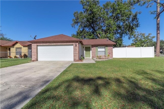 Building Photo - Freshly Painted 3/2 with Fenced Yard & Fireplace!