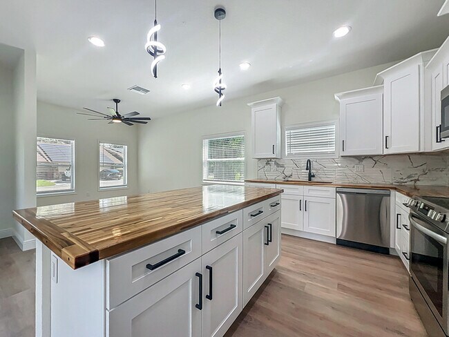 Building Photo - BRAND NEW CONSTRUCTION in the Heart of Pla...