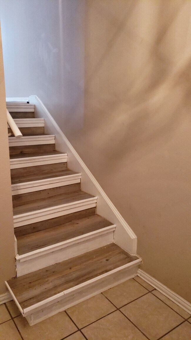 Stairs leading up to kitchen, dining, and livingroom - 500 E Avenue J