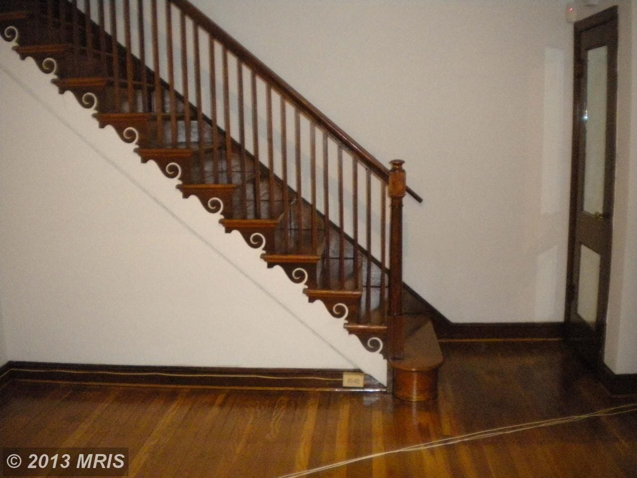 Living Room with Classic wooden detail on Stairs - 3967 Ames St NE