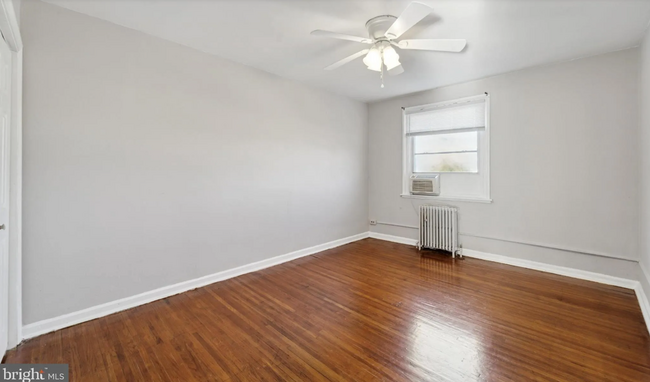 Master bedroom with hardwood floors - 339 E Essex Ave