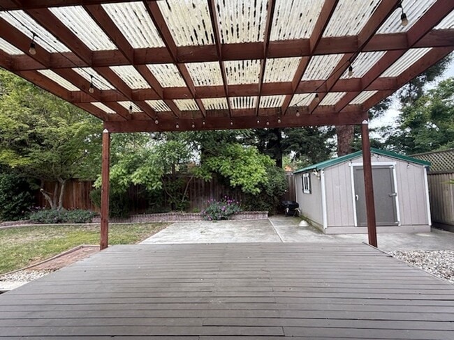 Building Photo - OPEN HOUSE this Wednesday 5pm-6:30pm - Private Redwood Setting | 4BR Home with Family Room, Bar &...