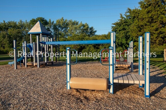 Building Photo - 2-Bed, 1-Bath Upper Unit with Garage & Porch – Steps from Paul Henry Trail