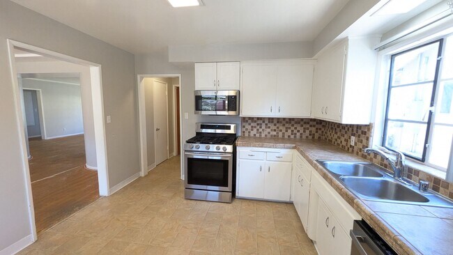 Building Photo - Available in July - New flooring and paint