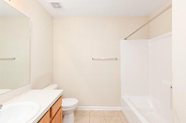 Building Photo - Beautifully Updated & Spacious 3BR/2BA Condo in a Secure Gated Community — Includes Cable, Intern...