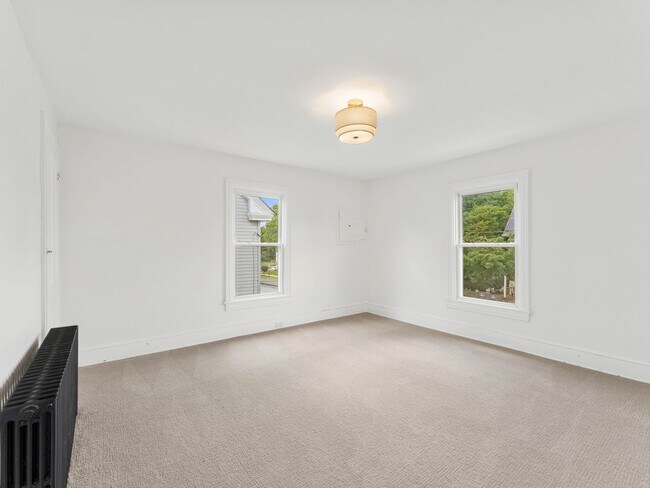 Building Photo - Renovated 3-Bedroom Apartment with Bonus Finished Attic & Spacious Shared Backyard