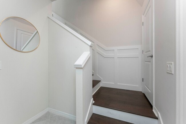 Building Photo - Introducing a captivating 3-story townhome...