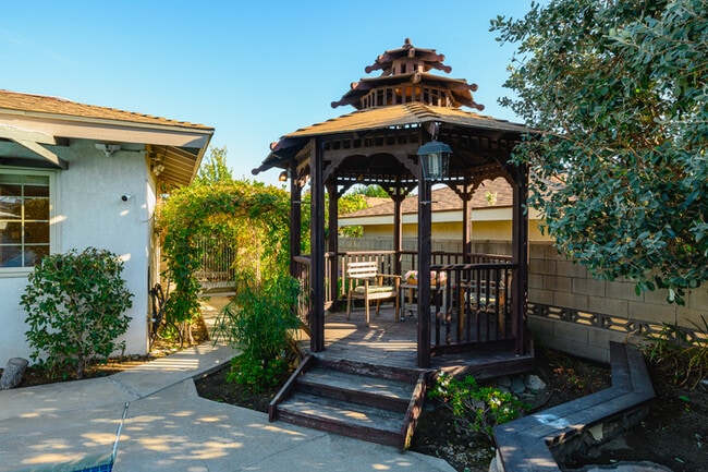 Building Photo - Luxury Estate with Sparkling Pool & Elegant Amenities