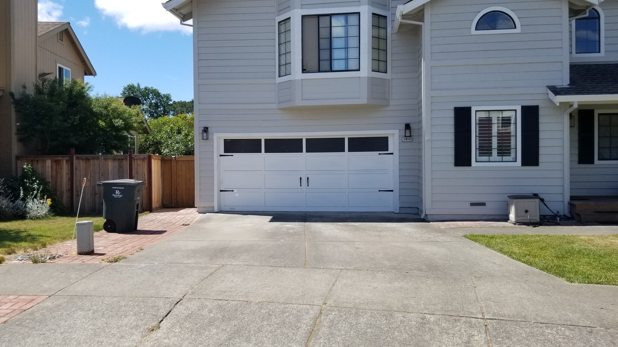 Your private entry is to the left of the garage. - 1912 Eversley Plz