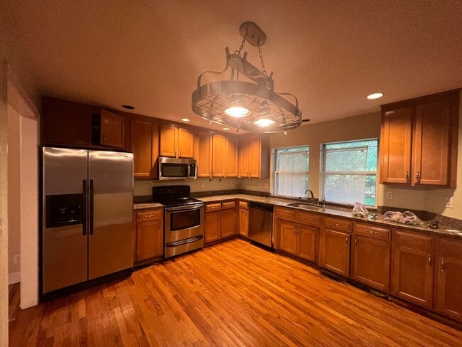 Building Photo - Massive 3 Bedroom 2.5 Bathroom Single-Family Home with Real Hardwood Floors and a Huge Two-Car Ga...