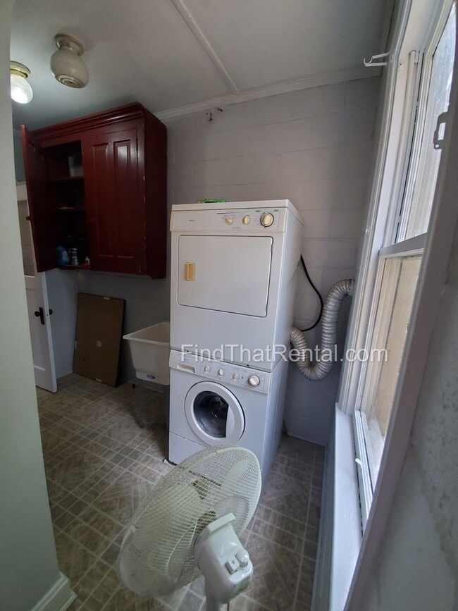 Building Photo - Charming Historic Retreat with Private Fenced Yard & Parking – Prime Downtown Location