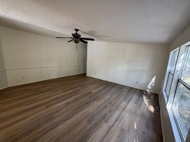 Building Photo - 3 bed 2 bath on one acre lot. New vinyl flooring throughout.