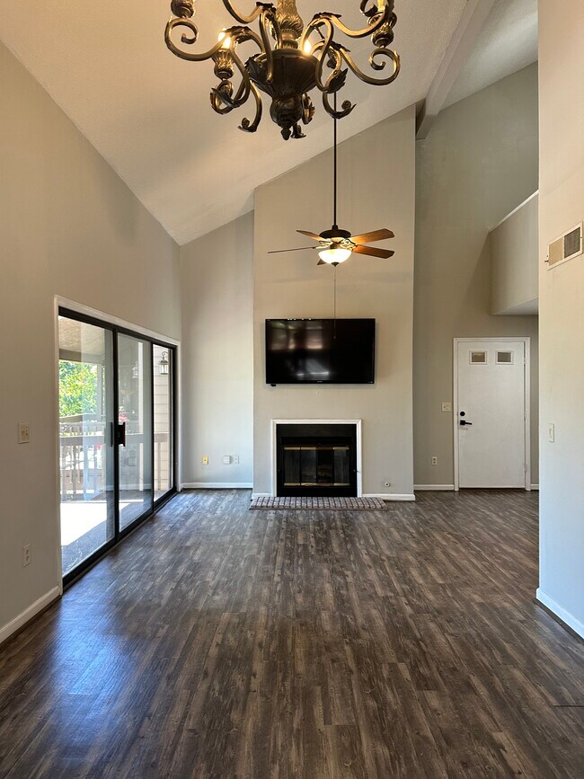 Open indoor outdoor living with a gas fireplace and a 60 inch TV - 116 Captains Way