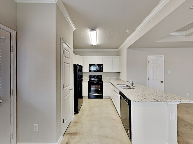 Kitchen with Granite Countertops, smoothtop cooking, Built-in Microwave and Refrigerator Included! - 6265 Eddie Way