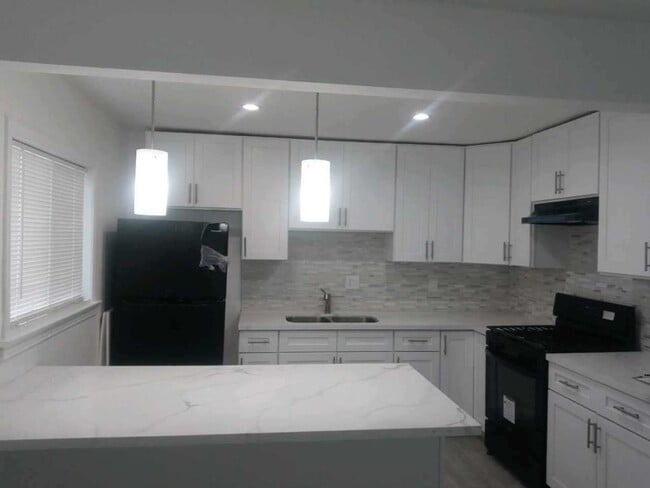 Building Photo - Welcome to 105th Homes, a thoughtfully des...