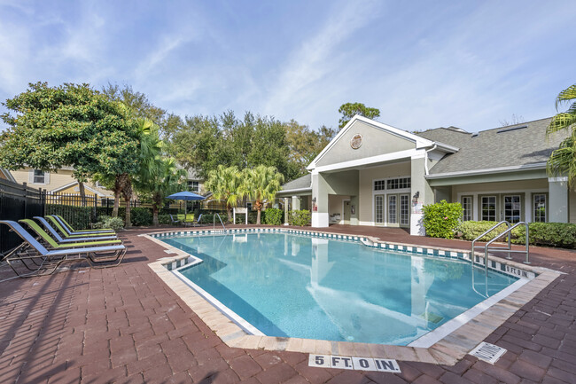 Swimming pool with lounge seating - Park Villas Apartments