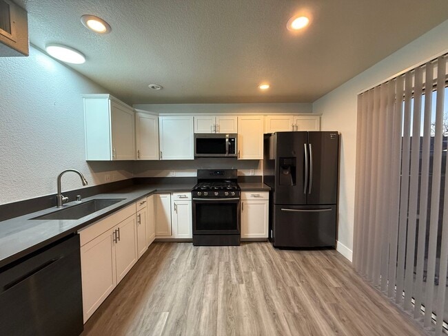 Building Photo - $500 OFF 1ST MONTHS RENT Updated 3-Bedroom Townhome in Gated Community with Pool Access