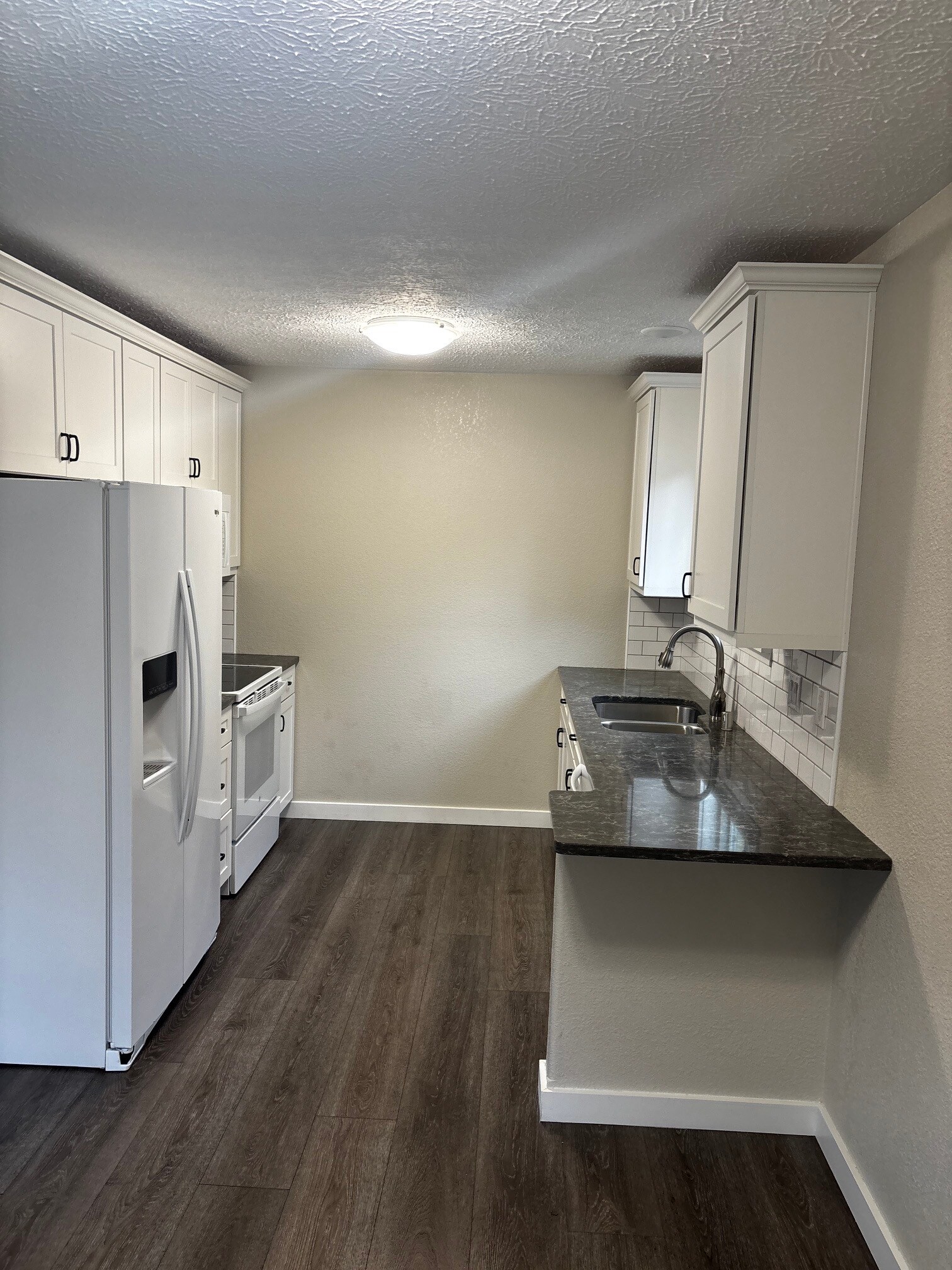 Kitchen view from dining area - 8204 Mentra St