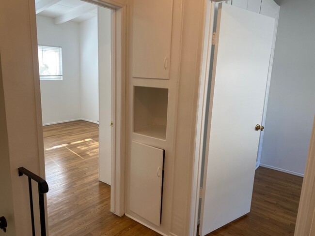 HALLWAY WITH LINEN CABINETS - 11435 1/2 Venice Blvd