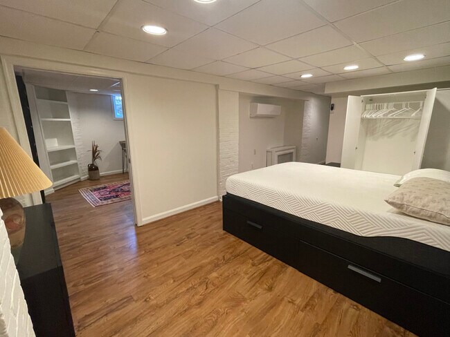 Bedroom 1, queen bed w under storage drawers; large closets - 1869 Park Rd NW