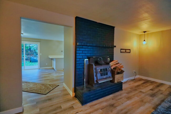Living room- wood fireplace - 13408 SE 20th St
