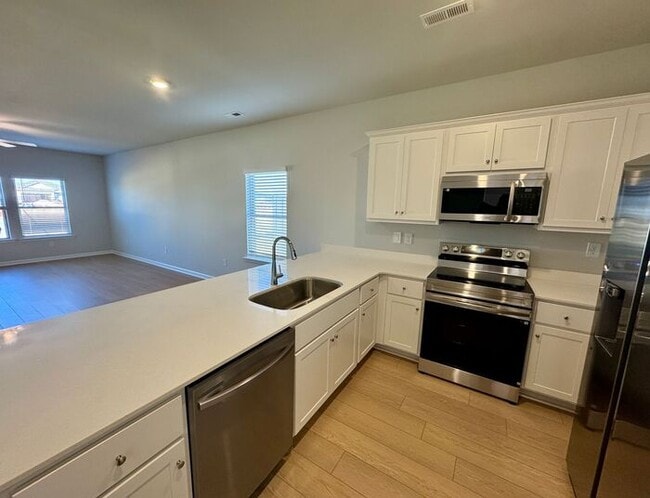 Building Photo - MOVE IN SPECIAL-NEW CONSTRUCTION-FENCED YARD