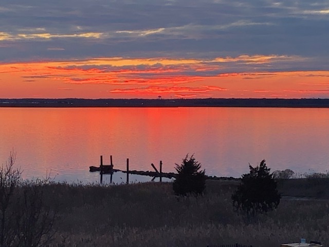 Colorful sunsets from front windows - 324 Sanderling Ln