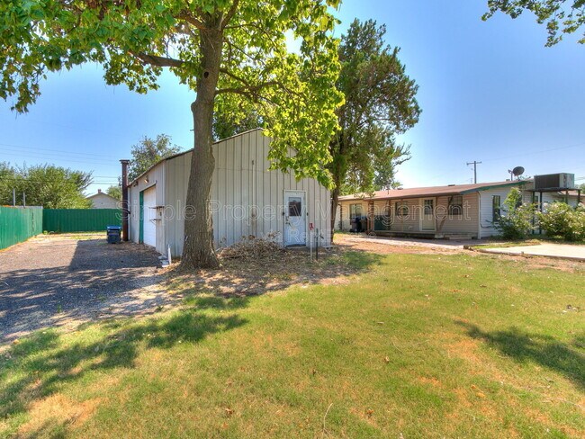 Building Photo - 9706 N Garnett Dr