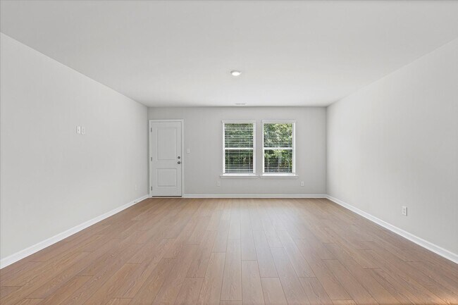 Building Photo - New 3BR Home in Whispering Woods – Modern ...