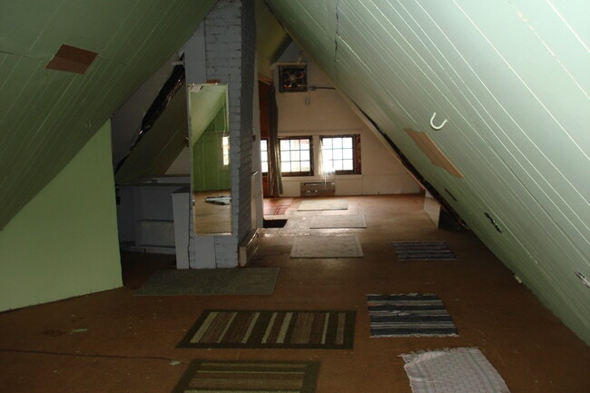 Attic Space looking toward the front of the home, workout room, play area? - 3402 N 28th St