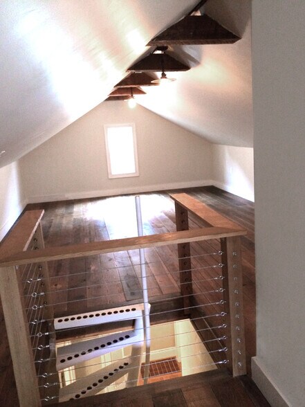attic space, full floor print of house, vaulted ceilings. middle 70% is easily walkable for a 6' person, good ceiling height. vaulting implies lower end wall heights (approx 3 feet at the low ends) - 4811 NE 31st Ave