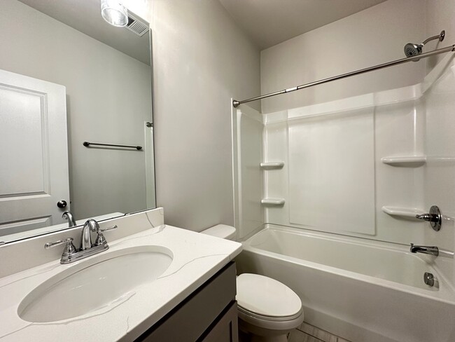 Building Photo - SPACIOUS TOWNHOME