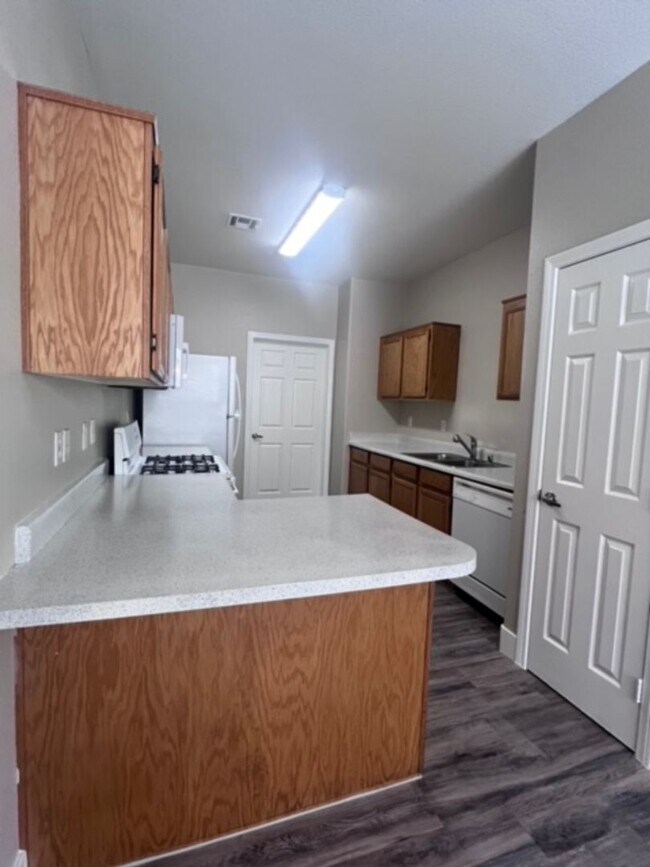 Building Photo - Three bedroom townhouse with 2 car garage